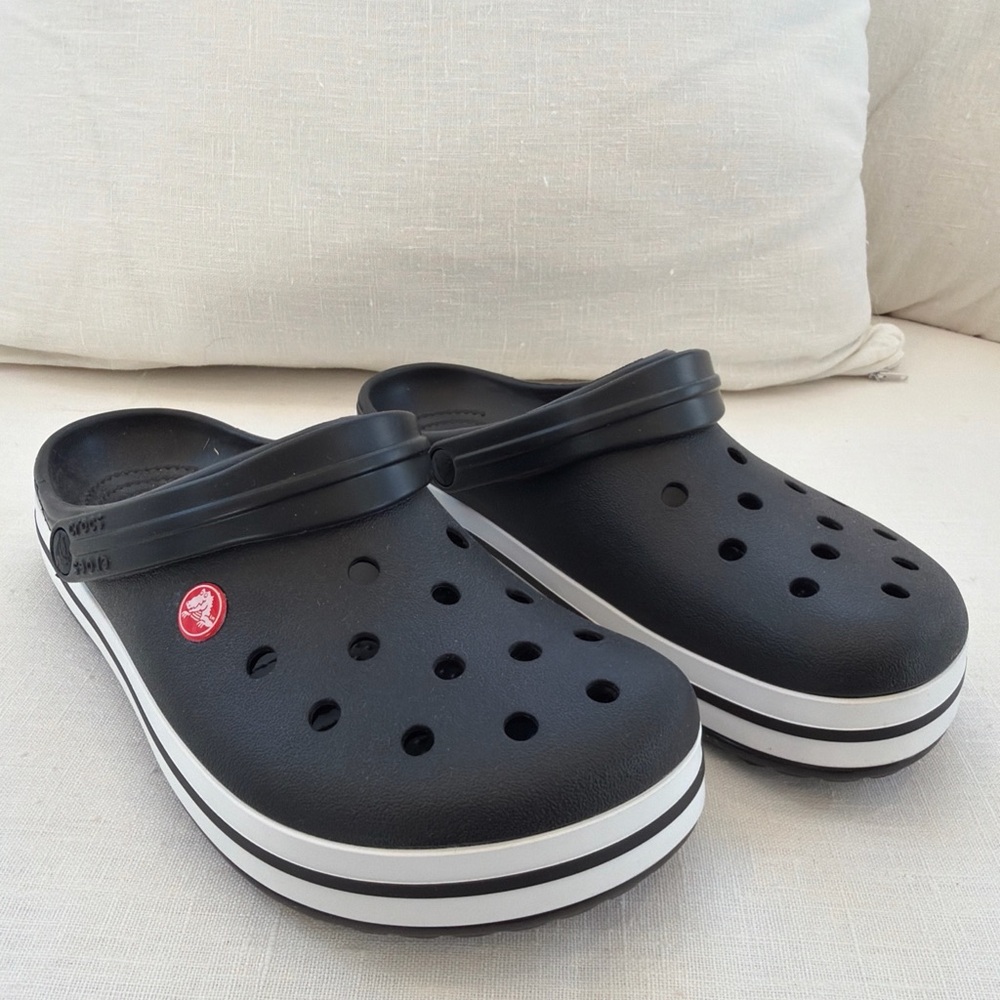 CROCS M/W Black Clogs with White Stripe and Red Logo